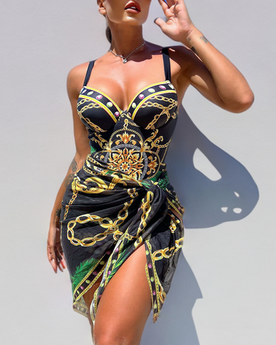 Clara® | Push-up one-piece swimsuit with decorative chain details and beach skirt